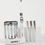 Julie Chrisley Instagram - Hey y'all! Today is the day. Freshen up your spring smile with the brightest, whitest bundle around!! This 2 piece bundle will give you a clean, sparkling smile in no time at all and includes The Brush toothbrush and The Pen whitening pens. Retail $234.99 on sale for The Chrisley Box Family for ONLY $99.95 The sonic vibrations of the The Brush with UV Sanitizer burst away plaque and remove debris while the UV sanitizer kills germs while also functioning as a storage unit for four brush heads and a charging dock for the toothbrush. The Snapwhite Teeth Whitening Pen has advanced gel that whitens BETTER and with LESS sensitivity than competing brands. It's so convenient and easy to use: just smile and brush on some gel. Teeth get whiter with each application. It's perfect for touch-ups and on-the-go whitening. This is a limited time & limited quantity offer! Order now and get this bundle in time for the perfect Mother's Day gift or to treat yourself to a refreshed pearly white smile!! These bundles will ship mid April. Happy shopping and thanks for your continued support! Julie & Savannah Link to buy in bio. #thechrisleybox #spring #chrisleys #buynow #smallbusiness #giveback #gift #giftbox #mothersday #treatyourself #smile #whitening #bundle