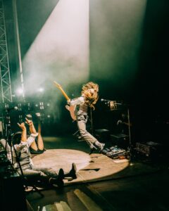 Julien Baker Instagram - This year has been so beautiful, so overwhelming, so replete with experience, so challenging and brain-bending, that I can hardly look away. I’ve been fortunate to be surrounded by people and met with situations that demand my attention, and I’ve been honored with the chance to show up for them (and lucky that @saladjockey has been there to artfully capture all the moments I most want to be awake for). I’ve been so proud to share the stage with my musical heroes and friends— prouder still at how often those two categories overlap. Every day I watch a huge community of touring professionals rely on each other to make something magical happen, and every day I get to see the gift of wonder, joy, and respite music brings to people. Thank you, thank you, thank you for another year participating in life on earth. Boygenius Fucking Rocks. 📸 by Ashley Gellman (@saladjockey)