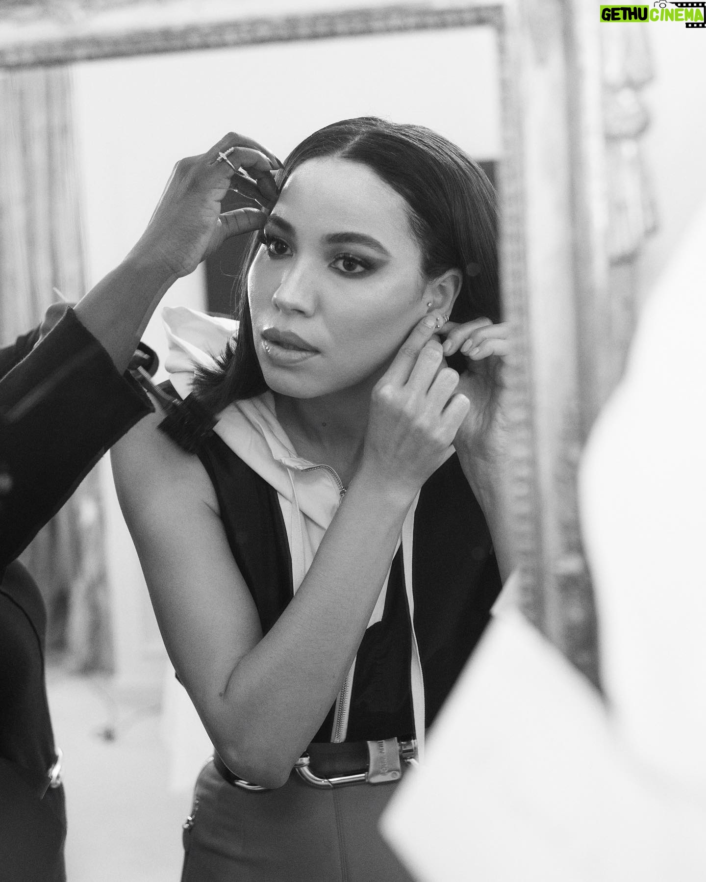 Jurnee Smollett Instagram - @jurneesmollett pregamed the @louisvuitton Spring 2024 show with a Beyoncé playlist and hot lemon water. In attendance, she wore a windbreaker-esque sleeveless jacket complete with a hood, juxtaposed with high-waisted fire-engine-red skinny pants, and topped it all off with a link-belt of exaggerated proportions across her midriff. “He finds a way within his silhouettes to create such a dance between the energies of the feminine and the masculine,” she muses about Louis Vuitton’s Creative Director @nicolasghesquiere. At the link in bio (or at coveteur.com), we get ready with Jurnee in her Paris hotel moments before the big show. Photographer: @artofv Writer: @camille_freestone Creative Producer: @talunzeitoun Stylist: @mandelkorn Hair Stylist: @naivashaintl Makeup Artist: @makeupvincent Location: @lebristolparis #LouisVuitton #JurneeSmollett