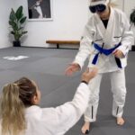 Justine Ezarik Instagram - Jiu Jitsu Vision Pro 😜🥽 How to arm bar a brown belt..? Thanks to @mariaelisaguermann for kindly letting me pass her guard to mount 😂😂 we all know that’d never ACTUALLY happen lol 🎥 @isabelajoness