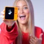 Justine Ezarik Instagram - The new @rabbit r1 device isn’t just super cute, but a total game changer for the future of standalone AI too! Head to the link in my bio to learn more! #ad