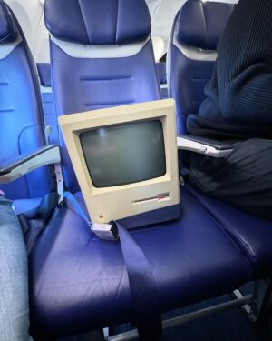 Justine Ezarik Instagram - Hahahaha I’d say the highlight was taking this old 1984 Mac to the Apple Spaceship park, but it was pretty awesome getting to sit in the cockpit for a photo 😂😂😂