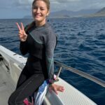 Justine Ezarik Instagram - The topside action on today’s dive was incredible 😂 perfect weather, a massive whale and her calf.. PLUS AN ACTUAL BABY SHARK (watch until the end)!!!!! We are working on our advanced certification this week — I am so excited for the future dive adventures after this! 🩵💙🌊🤿 @shilpa.rajpara @diveoceanic @baresports