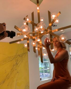 Karolína Kurková Instagram - Let there be LIGHT. 💡✨This piece is so special to me, not only because I designed it and collaborated alongside Maxim Velčovsky x @lasvitdesign , a Czech brand specializing in blown glass, but also because it reminds me of being a little girl and connecting me back to my childhood...blowing dandelions, making wishes. We named it "Pampeliska" which means dandelion.Thank you Léon for giving me the freedom and do something I have never done before #czechmade #blownglass #handmade #couture #kkstyle