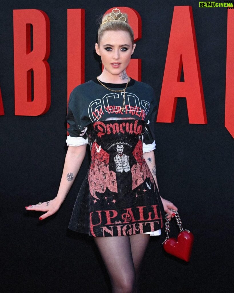 Kathryn Newton Instagram - I love ballet 🩰 @abigailthemovie thank you @giulianocalza @gcdswear and @officialuniversalmonsters for this perfect Dracula dress to celebrate @abigailthemovie The tattoos are Sammy’s from the film and the tiara I’ve had since I was like 8. Getting ready with @bridgetbragerhair and @ginabrookebeauty felt like Halloweennnnn