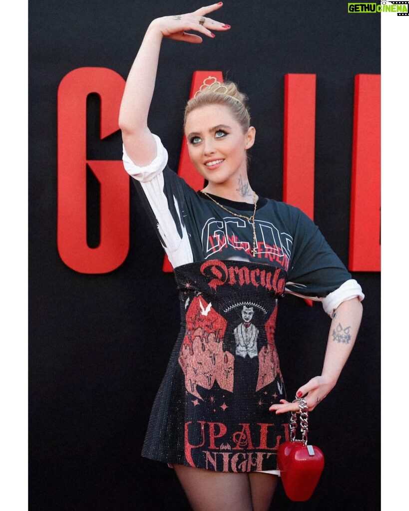 Kathryn Newton Instagram - I love ballet 🩰 @abigailthemovie thank you @giulianocalza @gcdswear and @officialuniversalmonsters for this perfect Dracula dress to celebrate @abigailthemovie The tattoos are Sammy’s from the film and the tiara I’ve had since I was like 8. Getting ready with @bridgetbragerhair and @ginabrookebeauty felt like Halloweennnnn