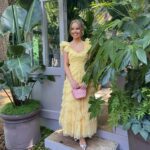 Katie Piper Instagram - Chelsea Flower Show 🌼🪴 Yesterday I supported a unique social enterprise @the_rhs, The Glasshouse. @theglasshousebotanics gives women in prison second chances by teaching them how to care for houseplants, so on release they have better employment opportunities making them more employable and less likely to reoffend.  I got to meet some of the women today and hear their stories of survival and reinvention. They have not only turned their own lives around but are mentoring other women to do the same. This is a fantastic scheme that truly works and I felt so hopefully and happy for all of the women involved 💛 Shout out to @malverngardenbuildings for sponsoring this initiative and believing in all of those involved 🙌 Hair @mauriceflynn Make up @toby_salvietto Styling @harrietnicolsonstylist Dress: @needleandthreadlondon Shoes: @malonesouliers Bag: @marni via @coggles Earrings: @needleandthreadlondon X @sorujewellery collab Sunglasses : @robertlaroche