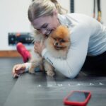 Katrin Tanja Davidsdottir Instagram – Theo loves helping me stretch 🤭🐾 and @gowod_mobilityfirst loves helping me prepare my body for the last week of THE OPEN! ✨ Last one, best one! What do you think we’ll see for 24.3?! @crossfitgames