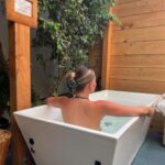 Kelli Berglund Instagram – thank you for having us @denmotherwellness 🌿 pure bliss is fighting for your life in an ice bath together