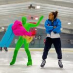 Kelli Erdmann Instagram - That third flip tho 👀 Who wants to see the results?! @elladjbalde ⛸️: @lakingsice_pickwickgardens #behindthescenes #bts #elladjbalde #happykelli #iceskating #greenman