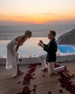 Kelsey Owens Instagram - WE’RE ENGAGED BABY!!!💍🤍 It’s crazy that a day I’ve dreamt about since I was a little girl has arrived. I think the younger me would be so happy to know she has a man who takes care of her, puts a smile on her face, and loves her like no one ever has before. Max…since the day I met you, you’ve never failed to surprise me and this day was NO different. You make my life like a fairytale so I truly thought this was just another night together shooting photos in a gorgeous location. Little did I know you were about to change my life forever. The idea of us starting a family, having a lifetime of adventures, and getting to laugh with you every single day till the day I die brings happy tears to my eyes. I feel like the absolute luckiest girl in the world to be your fiancé and future wifey ♥️ Thank you so much @kieferjewelers for helping Max pick out my dream ring, I can’t stop looking at it 🥹 📍@cavotagoomykonos 📷 @jeremyaustiin