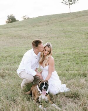 Kelsey Owens Instagram - Future Mr. & Mrs. Strong 🤍

I always pictured my engagement photos all done up and somewhere fancy, but last minute we landed on a field with our dog, champagne, & some pizza☺️ It could not be more us!

Photography: @tiffanymaysonetphoto
HMUA: @kissandmakeupbysteph