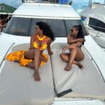 Kenya Moore Instagram - The things we talked about on this yacht! @kandi and @todd167 thank you for an amazing trip. Whew the bar has been raised! #kandtwerksnturks #thechocolates Swim and coverup @bfyne