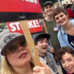 Kirsten Vangsness Instagram - All the folks with all the signs and all the #livelingandprosper energy today. Me (in my @katieabey “socks of success” for moral support) and @tommylenk found our people after coffee-ing ourselves and what a joy to see the sweetness that is @marythechief @msmadig @phinnykiyomura @niallnotniles @saltybabyla out in the streets doing the thing to make the cars honk. 🖖🏼🌈🌟 #wgastrong #wgastrike (ps Tom Lenk is being kind and making room in picture may the record show he is in fact taller than me)