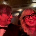 Kirsten Vangsness Instagram - My arm candy (not really, I find our friendship very nutritious, he’s more like arm mushrooms and I was his guest so that makes me the mushrooms) @neilhimself was wearing THE COOLEST SUIT while being his lovely self and being honored for being THE COOLEST CREATIVE @theartofelysium Neil Gaiman’s Heaven twas true nerd heaven- the set was a library and people read from books and genius @jeremyoharris was our librarian for the evening. @theartofelysium is doing extraordinary things using the arts to create heart opening experiences for folks in our most vulnerable communities, it’s a lovely place to volunteer and give to and I was happy to learn of them this evening.