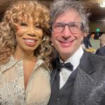 Kirsten Vangsness Instagram - My arm candy (not really, I find our friendship very nutritious, he’s more like arm mushrooms and I was his guest so that makes me the mushrooms) @neilhimself was wearing THE COOLEST SUIT while being his lovely self and being honored for being THE COOLEST CREATIVE @theartofelysium Neil Gaiman’s Heaven twas true nerd heaven- the set was a library and people read from books and genius @jeremyoharris was our librarian for the evening. @theartofelysium is doing extraordinary things using the arts to create heart opening experiences for folks in our most vulnerable communities, it’s a lovely place to volunteer and give to and I was happy to learn of them this evening.