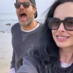 Krysten Ritter Instagram - Heaven is a cold overcast beach day for this vampire 🧛‍♀️ @geoffmstults has been my friend for almost 15 YEARS and remains one of the best eggs around. 🌊