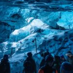 Kyle Krieger Instagram - I walked inside my first ice cave today on my first glacier walk — it was epic and so beautiful. Then rode home nekked after getting pummeled by an arctic wave on the beach which was the result of few questionable choices!!