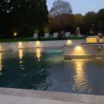 Laila Ali Instagram - 💦Buddy enjoys relaxing by the pool, listening to the fountains in the evening with me. Mediating, praying and sending positive out into our world.🥰