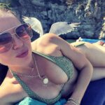 Lana Parrilla Instagram - What? How? When? 😱 Wild! When magic happens 🇮🇹 👙 🕊️ = 🪄😇 #ischia #italy #angelwings #holiday #photography #timing #potd ✨🙏🏽✨