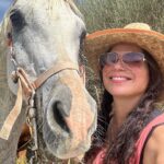 Lana Parrilla Instagram - After 17yrs, I decided to finally come back to the Sierra Nevada Mountains to ride with the best horseman in all of España at the @caballos_la_querencia campo 🐴 🇪🇸 I met my dear friend Fernando Reyero in the summer of 2006 when I decided to move to Spain to study Spanish and brush up on my horseback riding skills 3x a week for nearly 5 months. And where better than the Andalucia in España, right! Granada, Spain became one of my most favorite cities in the world. As someone who’s Spanish speaking skills were poor, you can imagine how intimidating it was to move to a foreign country, not knowing anyone and trying to connect with people who don’t speak your language. Luckily for me, I met one person who really helped me feel welcomed. I was immediately embraced by Fernando who’s English is perfect. He’s not only an incredible teacher and horseman, he’s a wonderful writer and a study of multiple languages. So when I arrived, he greeted me in English, Spanish and French and said, “Which do you prefer?” I replied, “English for now.” 🫣 If you’re looking for adventure on horseback in one of the most stunning places in the world, look no further. Fernando has the most beautiful horses & pups that will melt your heart upon meeting them. He’s created such a wonderful family with these animals and they will all go with you on the journey up the mountain and wait for you while you cool off with a refreshing drink & tapas while overlooking the impressive views of the Sierra Nevadas. This magical experience will keep you smiling for days! For the past 17yrs I’ve wanted to live in this part of Spain. I’ve honestly never been happier. Living with just my basic needs, surrounded by beautiful people, food and culture. And since this trip, I feel like I’m getting closer to that dream. Yay! Who knows, maybe we’ll end up riding together one day! 🤞 Plz go to @caballos_la_querencia for more information on how to have to the adventure of a lifetime. And please make sure to give Fernando a big hug for me! ❤️🇪🇸🐴🍻 #adventure #españa #horsebackriding #andalucia #spain #horses #riding #caballos #friendship #supportsmallbusiness #happiness #caballoslaquerencia #potd