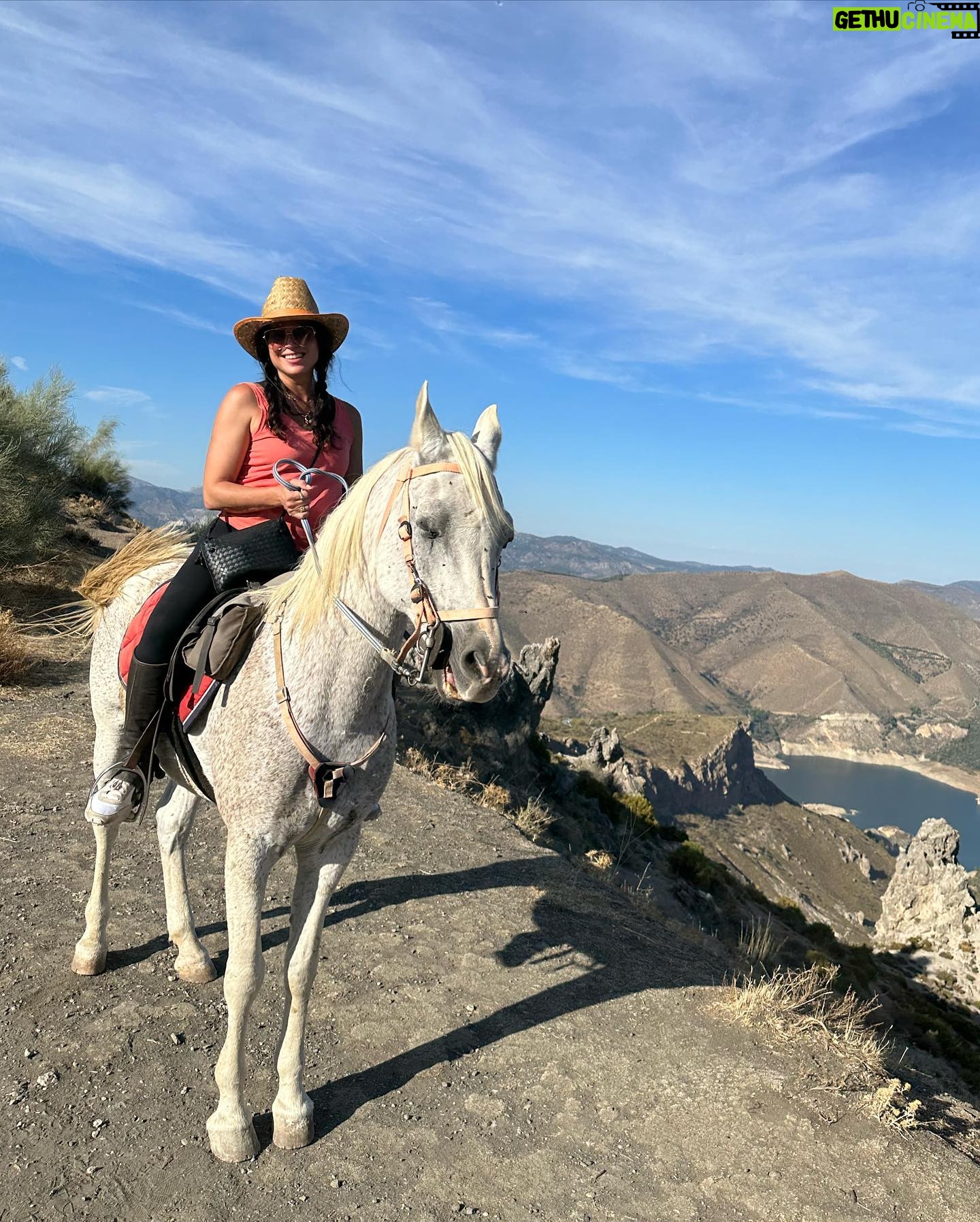 Lana Parrilla Instagram - After 17yrs, I decided to finally come back to the Sierra Nevada Mountains to ride with the best horseman in all of España at the @caballos_la_querencia campo 🐴 🇪🇸 I met my dear friend Fernando Reyero in the summer of 2006 when I decided to move to Spain to study Spanish and brush up on my horseback riding skills 3x a week for nearly 5 months. And where better than the Andalucia in España, right! Granada, Spain became one of my most favorite cities in the world. As someone who’s Spanish speaking skills were poor, you can imagine how intimidating it was to move to a foreign country, not knowing anyone and trying to connect with people who don’t speak your language. Luckily for me, I met one person who really helped me feel welcomed. I was immediately embraced by Fernando who’s English is perfect. He’s not only an incredible teacher and horseman, he’s a wonderful writer and a study of multiple languages. So when I arrived, he greeted me in English, Spanish and French and said, “Which do you prefer?” I replied, “English for now.” 🫣 If you’re looking for adventure on horseback in one of the most stunning places in the world, look no further. Fernando has the most beautiful horses & pups that will melt your heart upon meeting them. He’s created such a wonderful family with these animals and they will all go with you on the journey up the mountain and wait for you while you cool off with a refreshing drink & tapas while overlooking the impressive views of the Sierra Nevadas. This magical experience will keep you smiling for days! For the past 17yrs I’ve wanted to live in this part of Spain. I’ve honestly never been happier. Living with just my basic needs, surrounded by beautiful people, food and culture. And since this trip, I feel like I’m getting closer to that dream. Yay! Who knows, maybe we’ll end up riding together one day! 🤞 Plz go to @caballos_la_querencia for more information on how to have to the adventure of a lifetime. And please make sure to give Fernando a big hug for me! ❤️🇪🇸🐴🍻 #adventure #españa #horsebackriding #andalucia #spain #horses #riding #caballos #friendship #supportsmallbusiness #happiness #caballoslaquerencia #potd