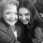 Landry Bender Instagram - In 2014 I worked with a 2nd AD who overheard me gushing to some crew members about how much I loved Betty and her spirit, longevity, and whip smart comedic timing. She came up to my mom and me at the end of the day and told us she worked on Hot in Cleveland and asked if we wanted to come to a taping to meet her. We went, and it was the only time in my life I’ve ever been star struck. She told me she liked my dress and I just stared back in awe, this photo is still framed in my bedroom to this day. The world suddenly feels so heavy today. RIP Betty. Thank you for inspiring me and adding so much joy into all of our lives ♥️