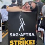 Landry Bender Instagram – I strike for the 10 year old me that joined the union and the 80 year old me that hopes to still be working. The majority of @sagaftra member’s job is simply AUDITIONING for the next job – and the majority of members don’t qualify for health insurance. (please consider donating to @sagaftrafound!) We marched this morning for unions in every field – we need fair wages and contracts. My favorite quote today from @msjoelyfisher: “What you are doing right now is bigger than any role you’ll ever play.” 🪧 #sagaftrastrong #unionstrong
