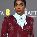 Lashana Lynch Instagram - Thank you @prada for this delicious custom look for @bafta last night. The baby hairs were proud to live in this moment, too! 💁🏾