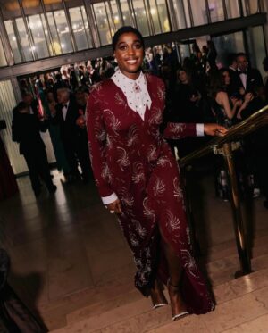 Lashana Lynch Instagram - Thank you @prada for this delicious custom look for @bafta last night. The baby hairs were proud to live in this moment, too! 💁🏾