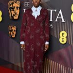 Lashana Lynch Instagram - Thank you @prada for this delicious custom look for @bafta last night. The baby hairs were proud to live in this moment, too! 💁🏾