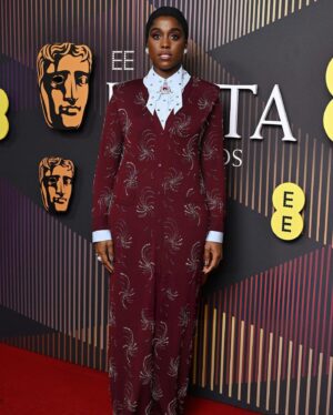 Lashana Lynch Instagram - Thank you @prada for this delicious custom look for @bafta last night. The baby hairs were proud to live in this moment, too! 💁🏾