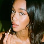 Laura Harrier Instagram - my current go to- @hourglasscosmetics shape and sculpt lip liner in candid and phantom volumizing glossy balm in wish #hourglasspartner