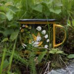 Laura Heikkala Instagram - Here’s a look behind the scenes in making of the Kitten Trail enamel mug from sketches to the final design!💕✨ Mugs will be up in my shop early August! Also just a heads up that Heikala will have a booth at Närcon at the C-huset with a bunch of mugs, books, prints and more✨ #närcon #närconsommar2023 #enamelmug #productdesign