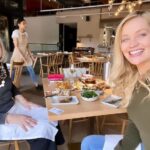 Laura Whitmore Instagram – Yesterday we said goodbye to Diana. I spent a lot of my London life living next door to Diana off Camden Road and on International Women’s Day as we celebrate so many great women, I want to celebrate her. 
We shared the same birthday 4th May ( also shared by our mutual favourite Audrey Hepburn) and the first picture is the last time I saw her when I brought her out for joint celebrations. She was actually 80 that day but only found that out at the funeral because she didn’t like to talk about age, it was just a number! 
Living in a city it’s a rarity to find such a kind neighbour you get close to. She lived in my building for 53 years and knew all the gossip on everyone. I adored our wine and nibbles evenings. And she was there through break ups, life’s up and downs and my career taking off in a city I didn’t know. You end up seeing your neighbours more than your family and I’m very grateful for her. Our doors faced each other with a small stairwell between and Mick would pop in for cuddles. She also thought it was hilarious some people she’d meet coming out of my flat in the stairwell. ( let’s say no more about that!) 
She loved music and the theatre and London life as much as me. I’ll never forget the second picture, I was backstage and the news was on showing the Queen’s funeral and there Diana was in her best pearls right up the front behind the prime minister! None of us actually know how she got there, she didn’t even tell anyone but nor were we surprised.
So thank you to Diana for being my London friend and sorry all those time you had to let me in when I locked myself out. You are pure class ❤️
