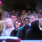 Laura Whitmore Instagram – Yesterday we said goodbye to Diana. I spent a lot of my London life living next door to Diana off Camden Road and on International Women’s Day as we celebrate so many great women, I want to celebrate her. 
We shared the same birthday 4th May ( also shared by our mutual favourite Audrey Hepburn) and the first picture is the last time I saw her when I brought her out for joint celebrations. She was actually 80 that day but only found that out at the funeral because she didn’t like to talk about age, it was just a number! 
Living in a city it’s a rarity to find such a kind neighbour you get close to. She lived in my building for 53 years and knew all the gossip on everyone. I adored our wine and nibbles evenings. And she was there through break ups, life’s up and downs and my career taking off in a city I didn’t know. You end up seeing your neighbours more than your family and I’m very grateful for her. Our doors faced each other with a small stairwell between and Mick would pop in for cuddles. She also thought it was hilarious some people she’d meet coming out of my flat in the stairwell. ( let’s say no more about that!) 
She loved music and the theatre and London life as much as me. I’ll never forget the second picture, I was backstage and the news was on showing the Queen’s funeral and there Diana was in her best pearls right up the front behind the prime minister! None of us actually know how she got there, she didn’t even tell anyone but nor were we surprised.
So thank you to Diana for being my London friend and sorry all those time you had to let me in when I locked myself out. You are pure class ❤️