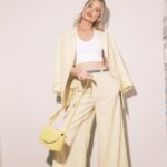 Laura Whitmore Instagram - In suit of sunshine @stellamccartney ☀️ Party shoes @louboutinworld Handmade bow @joepickeringtaylor Pure ‘class’ chain @margaret0connor Second last shot definitely telling Christian my best dad joke! LW X PFW