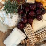 Lauren Luthringshausen Instagram - A quick last min cheese board before my friends bite my damn fingers off!! Gotta start making more ~fall~ vibe boards but here are my go to tips tricks! 🧀: obvi get an assortment, a couple soft cheeses, medium, hard 🧀: face your cheese outward so your guests aren’t awkwardly cutting into the board 🧀: use whatever leftover fruit & nuts you have to fill the gaps 🧀: Trader Joe’s spicy honey is a hit with the soft cheeses! 🧀: pre-cut your hard cheese for easy munching! 🧀: prepare before your guests arrive so cheese is about room temp & so you’re not rushing to feed your hangry friends like me! #cooking #cheeseboard #howto