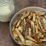 Lauren Luthringshausen Instagram - what if i just — stfu and made my baby some french fries? 🍟 recipe: One potato washed and cut Soak for at least 30min then dry well Olive Oil and Season however you like Bake at 325 for 20min to cook then turn up to 400 to crisp Dressing was measured with my heart and Matt’s tastebuds including: Mayo, Dill, Green Onion, One Lemon, Salt, Pepper, Onion Powder 🍟