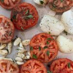 Lauren Luthringshausen Instagram - Big Ass Meatballs Roasted Tomato Sauce 🍅🤌🏼 ain’t too pretty but tasty as hell AND easy — set oven to 300 and slow roast tomato, onion, garlic with olive oil, salt, pepper, fresh oregano, dried basil till blistered not burnt. Hand mix or blend. With olive oil, a shallot, and garlic, add mix into pot. Using beef broth & wine for more liquid till it’s a liquid sauce but not soupy. Add salt, pepper, Parm rind, fresh parm, basil, and simmer for 30-40 min till thick. 🍅 For meatballs: 1 pound beef, 1 pound pork, 2 eggs, 2 slices of white bread soaked but strained in milk, 1/2 cup Parm, fresh oregano, salt, pepper, 3 garlic clove. Oven at 450 till brown but not fully cooked then transfer into sauce on low simmer and cook through for 25 min. Serve with bucatini, parm, and basil. 🍝