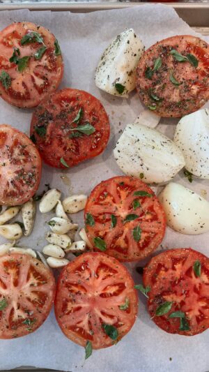 Lauren Luthringshausen Instagram - Big Ass Meatballs   Roasted Tomato Sauce 🍅🤌🏼 ain’t too pretty but tasty as hell AND easy — set oven to 300 and slow roast tomato, onion, garlic with olive oil, salt, pepper, fresh oregano, dried basil till blistered not burnt. Hand mix or blend. With olive oil, a shallot, and garlic, add mix into pot. Using beef broth & wine for more liquid till it’s a liquid sauce but not soupy. Add salt, pepper, Parm rind, fresh parm, basil, and simmer for 30-40 min till thick. 🍅 For meatballs: 1 pound beef, 1 pound pork, 2 eggs, 2 slices of white bread soaked but strained in milk, 1/2 cup Parm, fresh oregano, salt, pepper, 3 garlic clove. Oven at 450 till brown but not fully cooked then transfer into sauce on low simmer and cook through for 25 min. Serve with bucatini, parm, and basil. 🍝