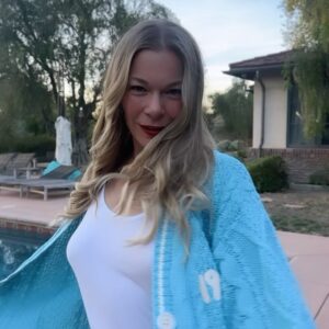 LeAnn Rimes Instagram - it’s a 1989 (“taylor’s version” of course) and red lip kinda day… thank you for my cardigan @taylorswift ✨

couldn’t resist a little recreate, seeing that it was halloween 🎃 and all!