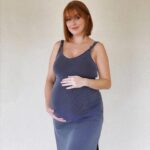 Leanna Decker Instagram - This body may be stretching this pre-pregnancy dress to its limits, but hey, it still fits, so yay! 🤣 Don't know how many more days I have left to document this bump 💙 we’re ready whenever you’re baby boy! ✨ #pregnancyjourney #thirdtrimester #stretchbabystretch #patientlywaiting