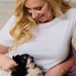 Leigh-Allyn Baker Instagram - Meet Fina. She’s my little ride or die. She wasn’t supposed to live past 8 because of a liver issue. But I make her food and did not vax and she will be 16 in January. Are you a dog person? 🐶#nationaldogday