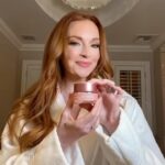 Lindsay Lohan Instagram – Adding @ClarinsUSA new multi-active day cream to my skincare routine for a youthful glow. 🩷 #ClarinsMultiActive #ClarinsPartner