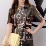 Liu Yifei Instagram - #LVFW23 Join #LiuYifei for #LVFW23. Wearing a leather dress with a trompe l’oeil pattern and boots by @NicolasGhesquiere, the House Ambassador shares her thoughts on the collection and how excited she is to be in Paris for the #LouisVuitton Women’s Fall-Winter 2023 show.