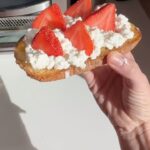 Lo Bosworth Instagram - A delicious daily breakfast (bc we know it’s so important to get your fuel for the day) that’s a new spin on cottage cheese toast: sourdough (naturally low gluten), lemon curd orange marmalade, whole milk cottage cheese, strawberry slices. Result is a balanced meal high in protein, some carbs, and fiber! Also, pls ignore my bed head. Xx