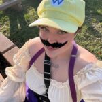 Loey Lane Instagram - I’m working late, cause I’m a plumberrr 🎶 Wario and Waluigi (aka bestie @snitchery) take the Ren Faire 💛💜 Yes, people yelled “wah” at us all day. Yes, I had to glue back on my mustache with eyelash glue like five times because every time I talked it slipped into my mouth. 10/10 would cause chaos again ✨ #renfaire #wario #cosplay #plussize