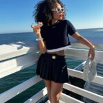 Logan Browning Instagram - @miumiu summer club 🌊🛥️ (authentic convos, luxe looks, perfect weather, that fun claw game with prizes, lobster rolls, vibey music, @georgiagetsby’s first performance, tarot, & ice cream!) thank you for having me 🤍 #miumiu #miumiuclub