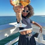 Logan Browning Instagram - @miumiu summer club 🌊🛥️ (authentic convos, luxe looks, perfect weather, that fun claw game with prizes, lobster rolls, vibey music, @georgiagetsby’s first performance, tarot, & ice cream!) thank you for having me 🤍 #miumiu #miumiuclub